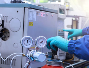 Technician inspecting fire sprinkler system components during evaluation process