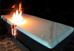 Mattress exposed to open flame during 16 CFR 1633 fire test