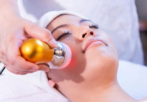 Facial treatment with laser and ultrasound in a medical spa cent