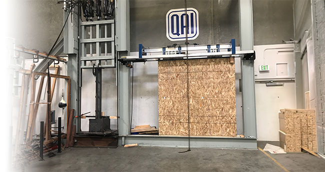 Wall panel undergoing structural load testing in a QAI laboratory