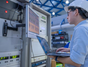 Electrical engineer male checking voltage at the Power Distribut