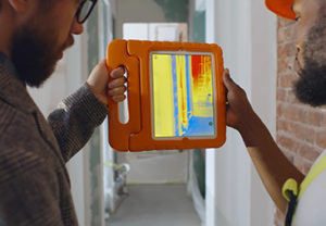 Thermal Imaging of Building Insulation Construction professionals using thermal imaging to assess insulation performance in a building