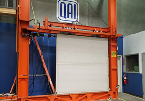 Wall panel mounted in structural test frame for racking shear testing